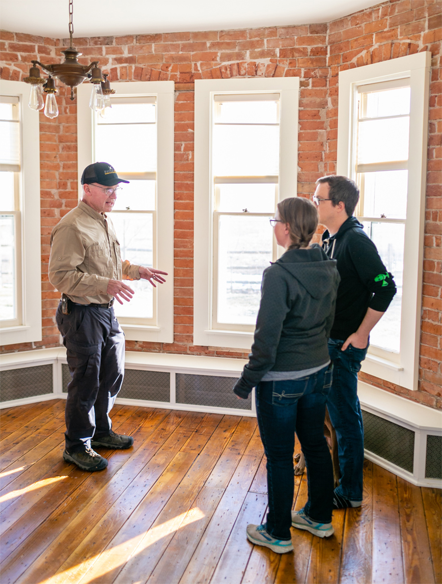 Home inspector talking with home inspection services customers